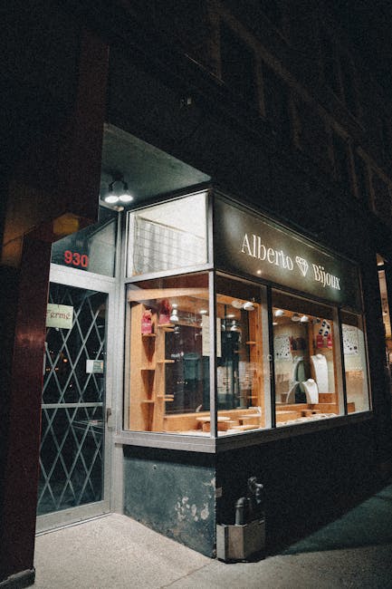 Via de' Tornabuoni jewelry boutique window display evening