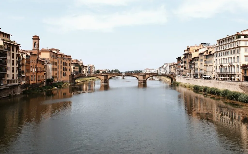 Florence Ponte Santa Trinita reflections calm water