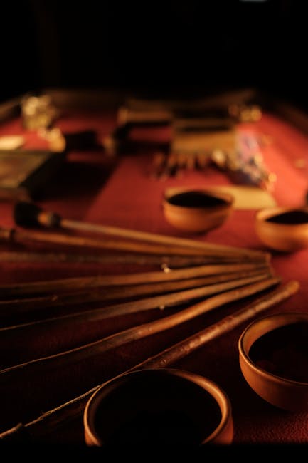 Close-up of historic wooden tools and bowls displayed in a Florence museum.
