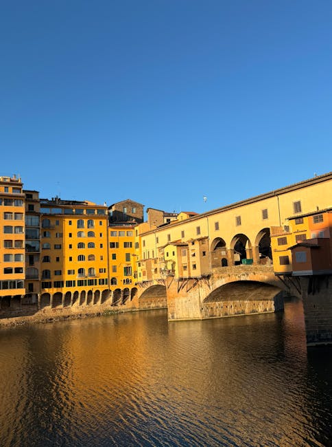 Ponte Vecchio sunset river reflection Florence